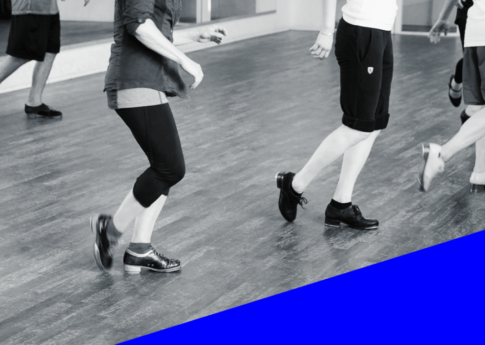 Backstage Studio: Legs and shoes of tap dancers during class