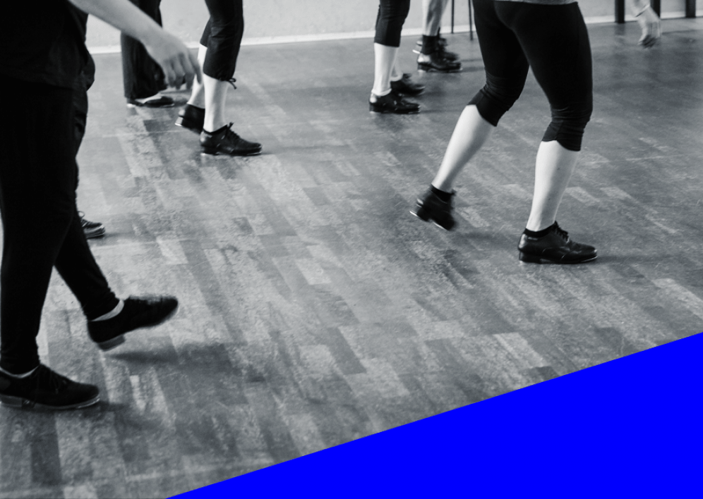 Backstage Studio: Legs and shoes of tap dancers during class