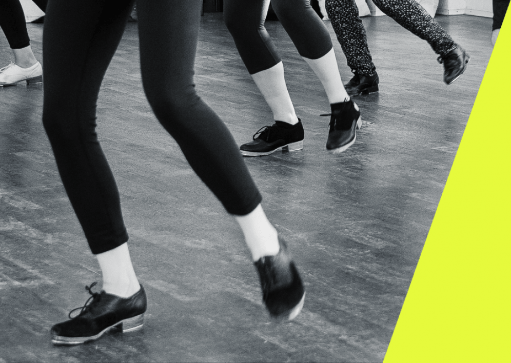 Backstage Studio: Legs and shoes of tap dancers during class